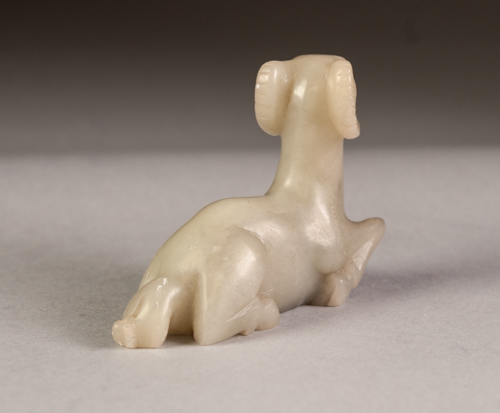 CHINESE CARVED MUTTON FAT JADE COLOURED HARDSTONE MODEL OF A RAM, modelled kneeling, 2 ½" (6.3cm) - Image 3 of 3