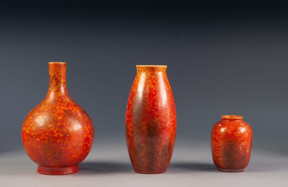 THREE PILKINGTONS ROYAL LANCASTRIAN ORANGE VERMILLION GLAZED POTTERY VASES WITH BLACK RUNNINGS,