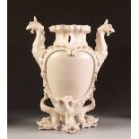 A LATE NINETEENTH CENTURY CONTINENTAL CREAM GLAZED PORCELAIN TWO HANDLED VASE, the body with