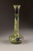 WILLIAM MOORCROFT CORNFLOWER PATTERN TUBE LINED POTTERY VASE, of squat form with tall, slightly