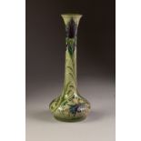 WILLIAM MOORCROFT CORNFLOWER PATTERN TUBE LINED POTTERY VASE, of squat form with tall, slightly