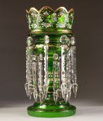 VICTORIAN GREEN TINTED GLASS TABLE LUSTRE, of typical form with angular wavy rim and prismatic
