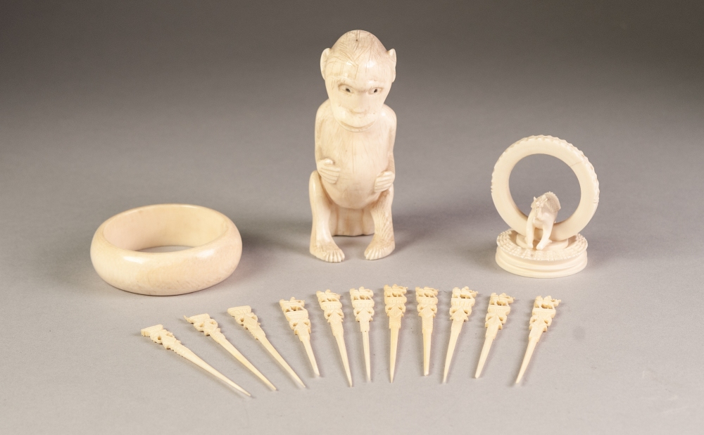 AFRICAN CARVED ONE PIECE IVORY MODEL OF A SEATED MONKEY, 4 ¾" (12cm) high, together with an IVORY