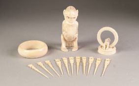 AFRICAN CARVED ONE PIECE IVORY MODEL OF A SEATED MONKEY, 4 ¾" (12cm) high, together with an IVORY