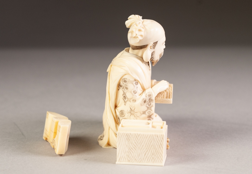 JAPANESE MEIJI PERIOD CARVED SECTIONAL IVORY OKIMONO OF A STREET VENDOR, modelled seated with a - Image 5 of 6