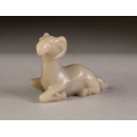 CHINESE CARVED MUTTON FAT JADE COLOURED HARDSTONE MODEL OF A RAM, modelled kneeling, 2 ½" (6.3cm)