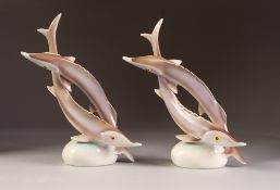 PAIR OF HOLLOHAZA, HUNGARIAN PORCELAIN MODELS OF ENTWINED FISH, 9" (22.9cm) high, printed marks, (