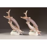 PAIR OF HOLLOHAZA, HUNGARIAN PORCELAIN MODELS OF ENTWINED FISH, 9" (22.9cm) high, printed marks, (