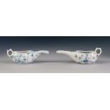 TWO MEISSEN STYLE ANTIQUE PORCELAIN INVALID FEEDING CUPS, painted in underglaze blue with 'Onion'