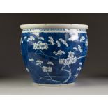 NINETEENTH CENTURY CHINESE BLUE AND WHITE PORCELAIN JARDINIÈRE, of typical form, painted with prunus