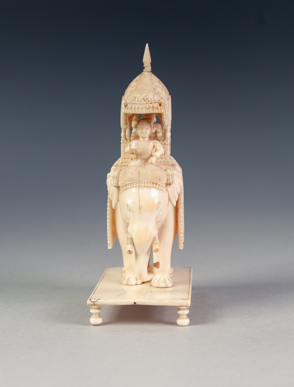 EARLY TWENTIETH CENTURY INDIAN CARVED IVORY GROUP OF FIGURES IN A HOWDAH ON A CEREMONIAL ELEPHANT, - Image 6 of 7