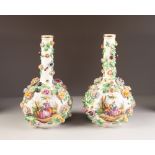 A PAIR OF LATE NINETEENTH CENTURY DRESDEN PORCELAIN BOTTLE SHAPED VASES, each encrusted with