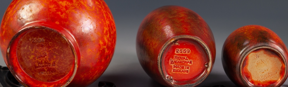 THREE PILKINGTONS ROYAL LANCASTRIAN ORANGE VERMILLION GLAZED POTTERY VASES WITH BLACK RUNNINGS, - Image 2 of 2