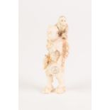 JAPANESE MEIJI PERIOD SMALL ONE-PIECE CARVED IVORY OKIMONO OF A MAN SUPPORTING A MONKEY on his