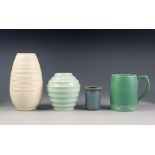 KEITH MURRAY FOR WEDGWOOD, GREEN GLAZED MOULDED POTTERY MUG, 5" (12.7cm) high, together with a
