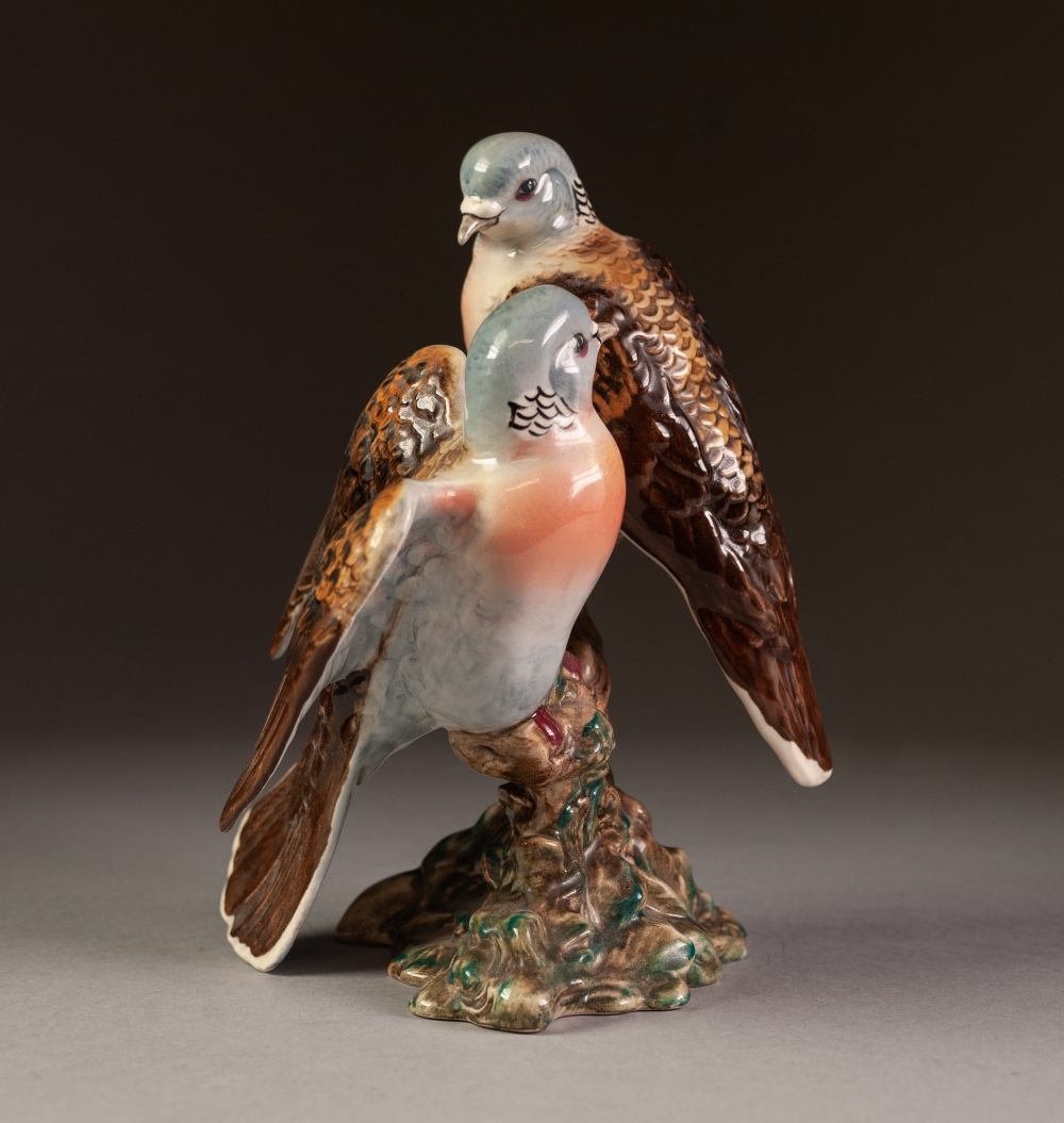 BESWICK POTTERY GROUP OF TWO BIRDS, modelled perched on a branch, one with wings open, 7 ½" (19cm)