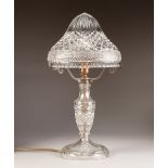 1930's CUT GLASS TABLE LAMP, with vase shaped column, high domed shade with gilt metal fittings, and