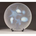 a 1930'S FRENCH VERLUX MOULDED OPALESCENT GLASS SHALLOW DISH, in relief with star fish, shells and