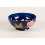 WALTER MOORCROFT MAGNOLIA PATTERN TUBE LINED POTTERY BOWL, of steep sided, footed form, painted in
