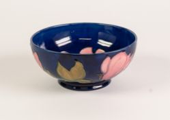 WALTER MOORCROFT MAGNOLIA PATTERN TUBE LINED POTTERY BOWL, of steep sided, footed form, painted in