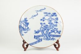 A JAPANESE LATE MEIJI PERIOD PORCELAIN WALL PLAQUE, transfer printed in underglaze blue with two