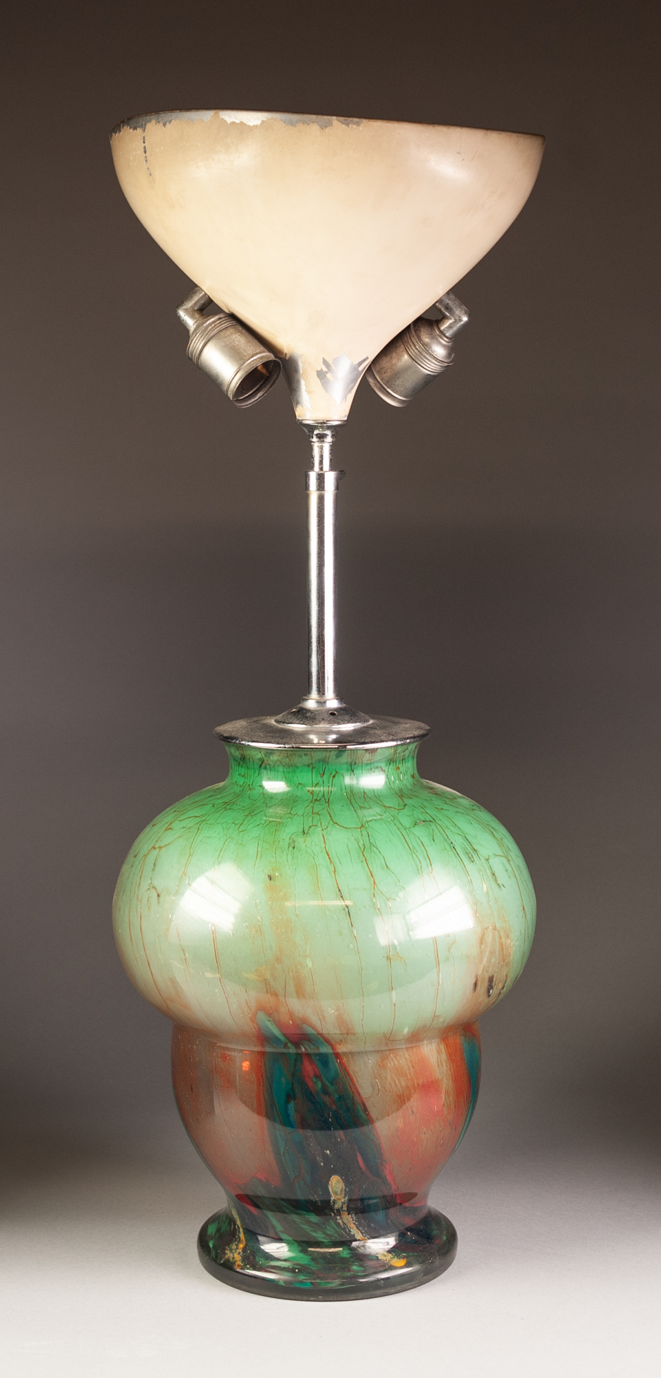 a 1930's PROBABLY AUSTRIAN ART GLASS AND CHROMIUM PLATED METAL ELECTRIC LAMP, the inverted acorn