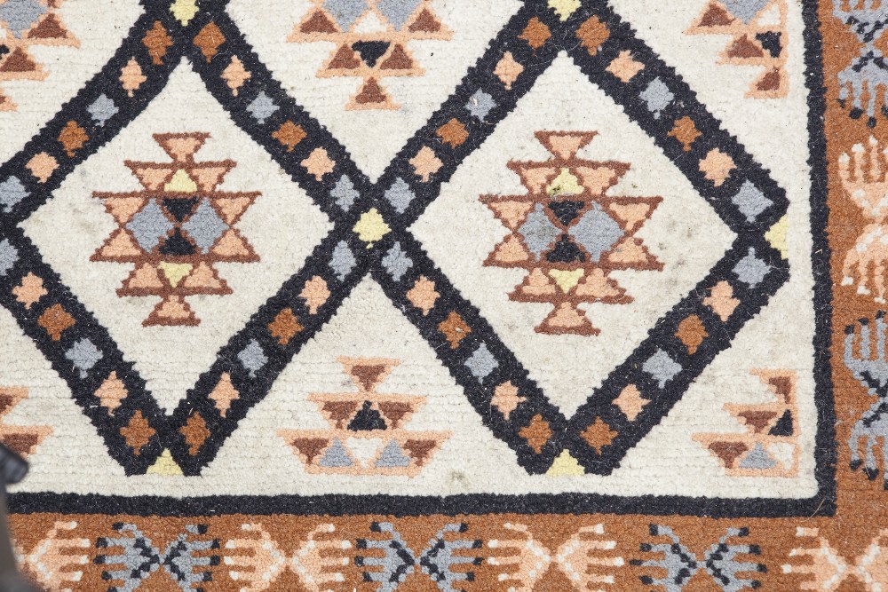 EASTERN RUG, decorated with rectangular guls within a trellis pattern on an off white field, the - Image 2 of 6