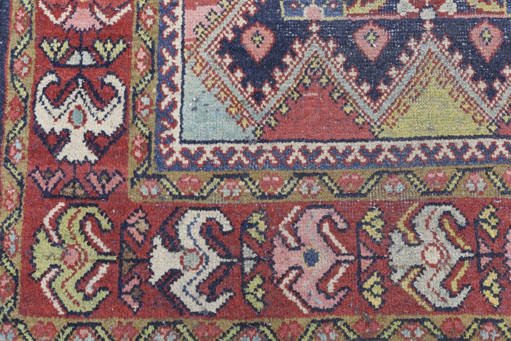 EASTERN RUG, with multi colour heratic floral design on a midnight blue field with zig zag - Image 2 of 2