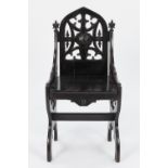 VICTORIAN GOTHIC REVIVAL CARVED AND DARK STAINED OAK CHAIR, the arched back with pierced tracery and