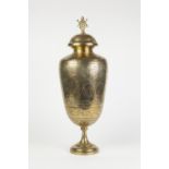 A TALL LATE NINETEENTH/EARLY TWENTIETH CENTURY INDIAN POLISHED BRASS PEDESTAL OVIFORM COVERED