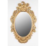 MODERN GEORGIAN REVIVAL OVAL CARVED GILTWOOD FRAMED BEVELLED EDGE MIRROR, labelled Harrison & Gil (