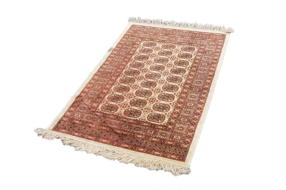 EASTERN RUG, decorated with rectangular guls within a trellis pattern on an off white field, the - Image 3 of 6