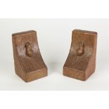 A PAIR OF ROBERT THOMPSON 'MOUSEMAN' ADZED OAK BOOK ENDS, each with carved mouse, 6 1/4" (16cm) high