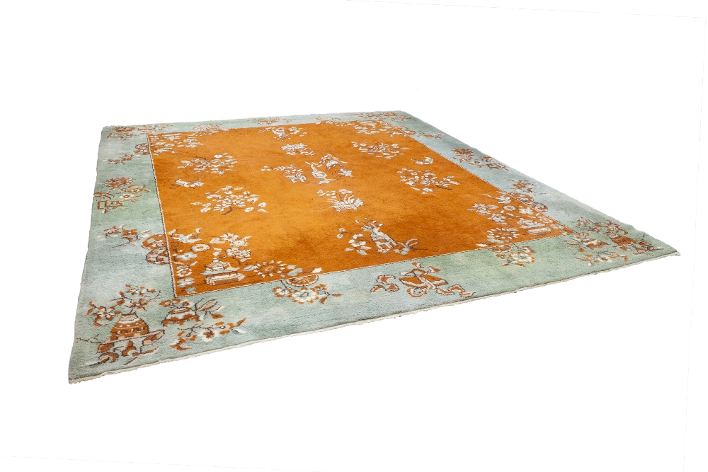 INDIAN CARPET, with chinoiserie scattered decoration of vases of flowers and floral sprays on a