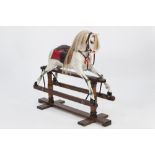 POSSIBLY KENSINGTON ROCKING HORSE COMPANY, DAPPLE GREY CARVED AND PAINTED WOOD PLATFORM ROCKING