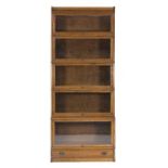 EARLY TWENTIETH CENTURY GLOBE WERNICKE STYLE FIVE SECTION OAK STACKING BOOKCASE, of typical form