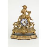 EARLY TWENTIETH CENTURY FRENCH GILT METAL FIGURAL MANTLE CLOCK, the 3" enamelled Roman dial' powered