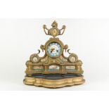 LATE NINETEENTH CENTURY FRENCH GILT METAL AND HAND PAINTED PORCELAIN MOUNTED MANTLE CLOCK, the