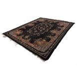 PROBABLY FRENCH SEMI ANTIQUE HAND WOVEN ALL-WOOL CARPET, with large oval floral wreath and ribbon on