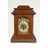 EARLY TWENTIETH CENTURY JUNGHANS OAK CASED MANTLE CLOCK, the 6" brass dial with silvered Arabic