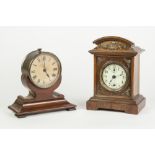 TWO EARLY TWENTIETH CENTURY SPRING DRIVEN SMALL MANTLE/ DRESSING TABLE CLOCKS, one of drum top