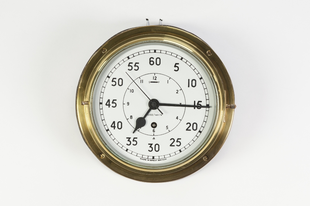 BRASS CASED BULKHEAD CLOCK, of typical form with subsidiary hours dial to the centre, numbered 0552/