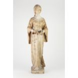 LATE NINETEENTH CENTURY CARVED VARIEGATED MARBLE FEMALE FIGURE, modelled standing, reading from an