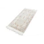 WASHED CHINESE EMBOSSED RUG, with Aubusson design on mushroom field with off white border, 5' x 2'6"