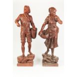 A PAIR OF LATE NINETEENTH CENTURY RED PAINTED SPELTER FIGURES OF FISHERFOLK, 27" (68.5cm) HIGH