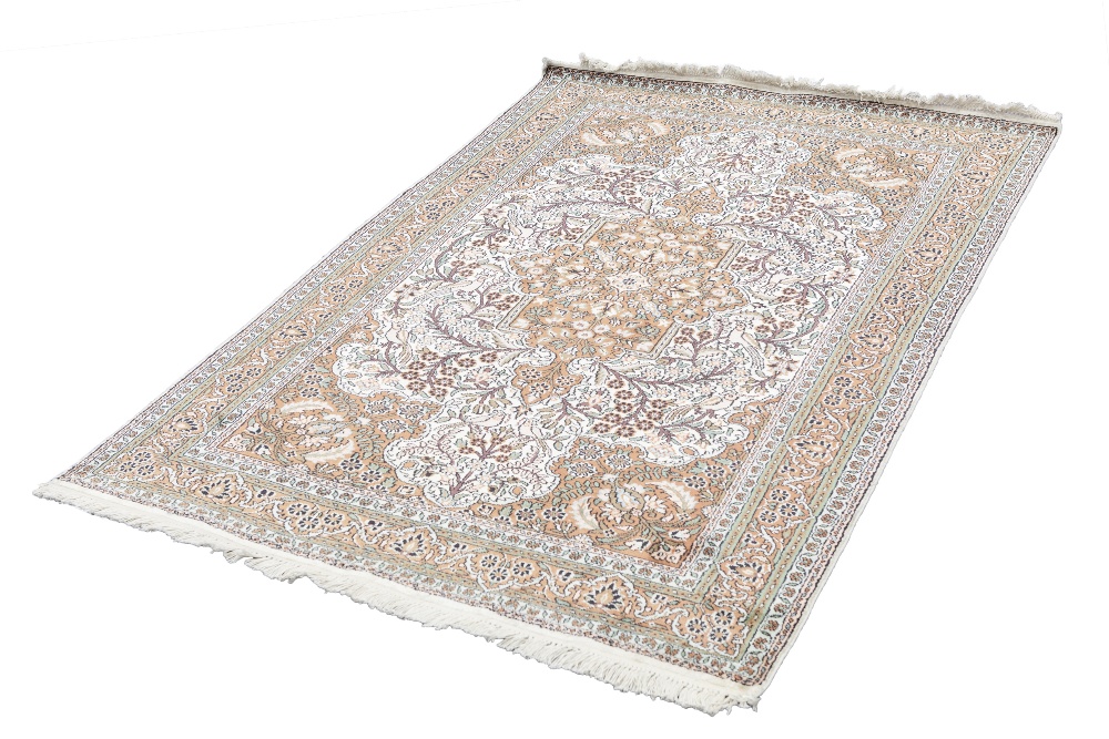 EASTERN SILKY PILE RUG, with pink and floral centre medallion with pendants on a white field wit