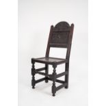 LATE STUART PERIOD SINGLE OAK CHAIR with carved panel back with sunken wooden seat. on turned