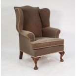 EARLY TWENTIETH CENTURY GEORGIAN STYLE WING BACK EASY ARM CHAIR, covered in light brown plush and