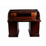 LATE NINETEENTH CENTURY OAK CYLINDER ROLL TOP DESK, polished as mahogany, of typical with blonde