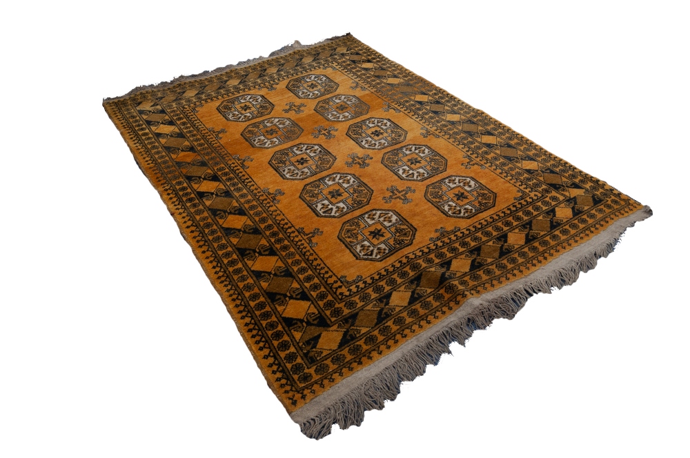 TURKOMAN AFGHAN RUG with two rows of five octagonal guls on an old gold ground, patterned